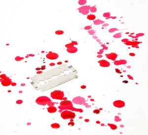 Razor Blade With Drop Of Blood Stock Photo courtesy of freedigitalphotosdotnet